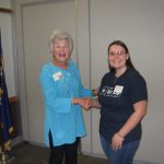 Chapter president Coral Fry presents the chapter's 2016 scholarship to Desiree Rachwal of Constantine.